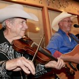 Wendall Miller and his bandmates play country music as dinners muched on lobster and steaks.
